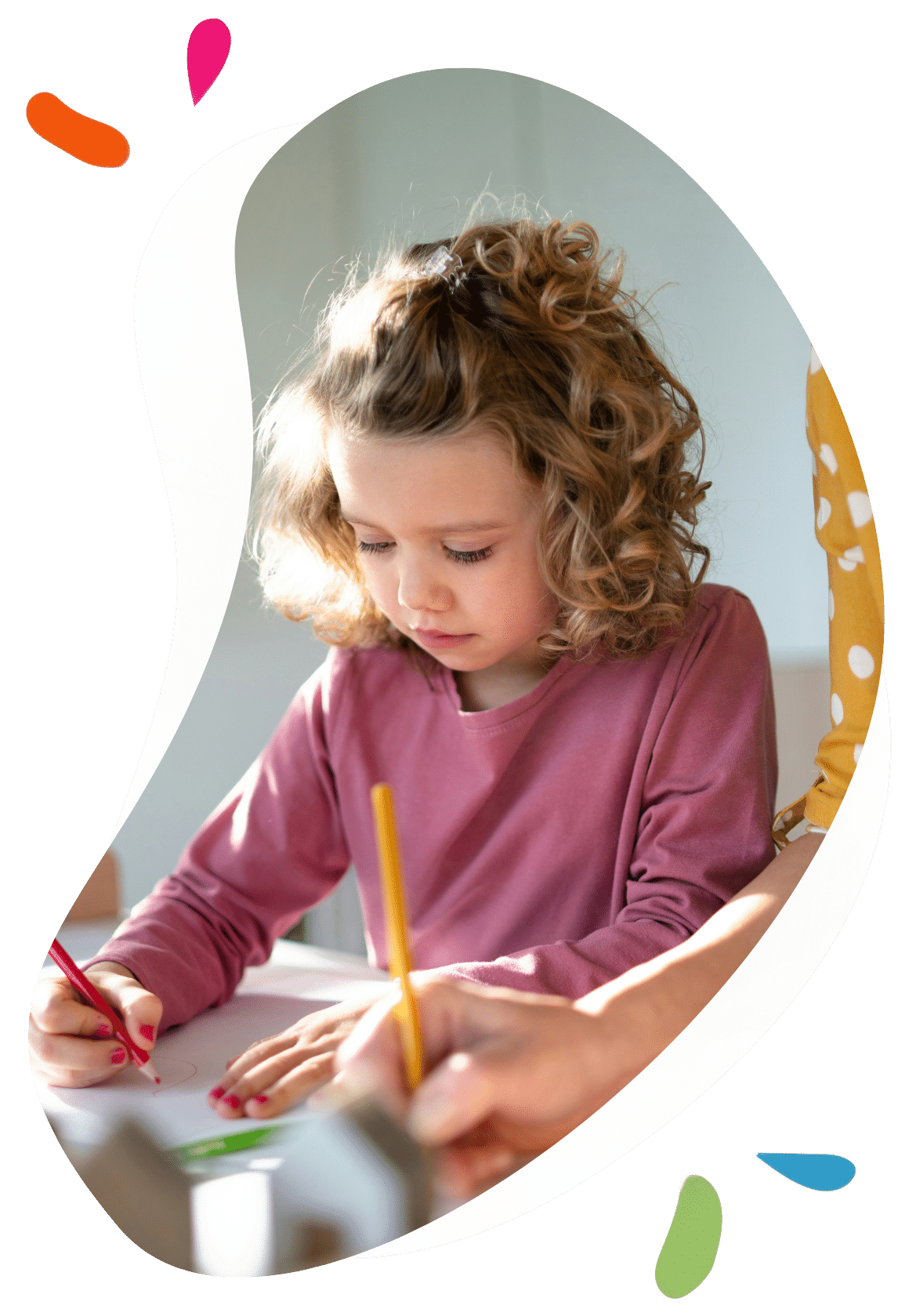 young girl drawing with a pencil